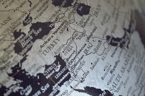 Photograph of a globe with a focus on the Middle East Region